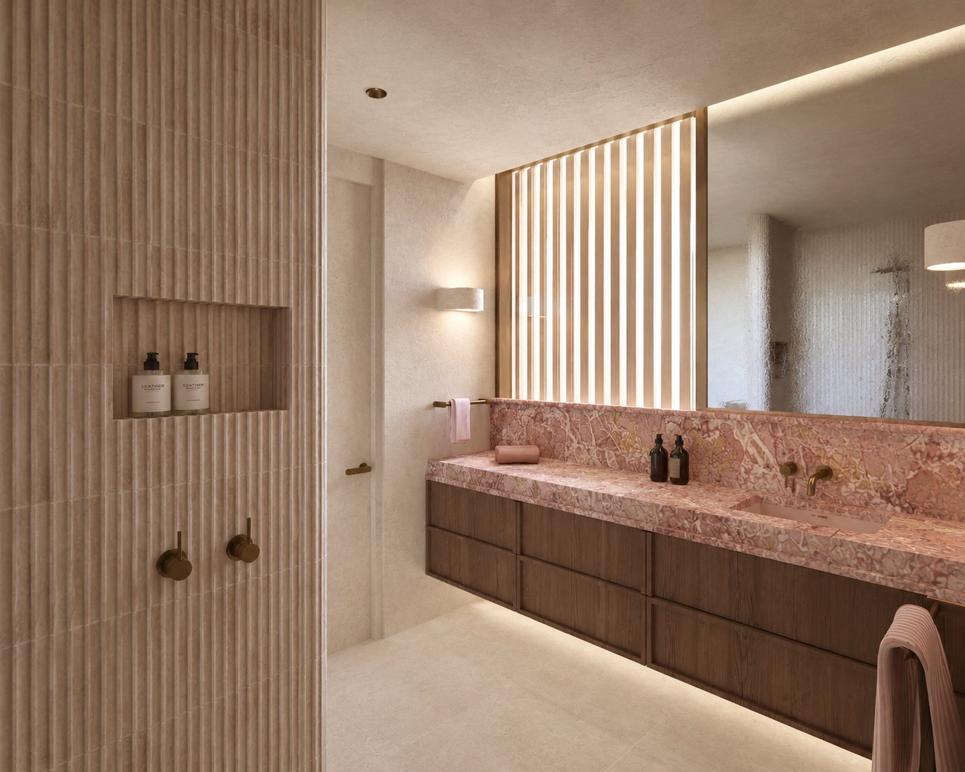 Double vanity in rosso marble beside a fluted travertine shower niche