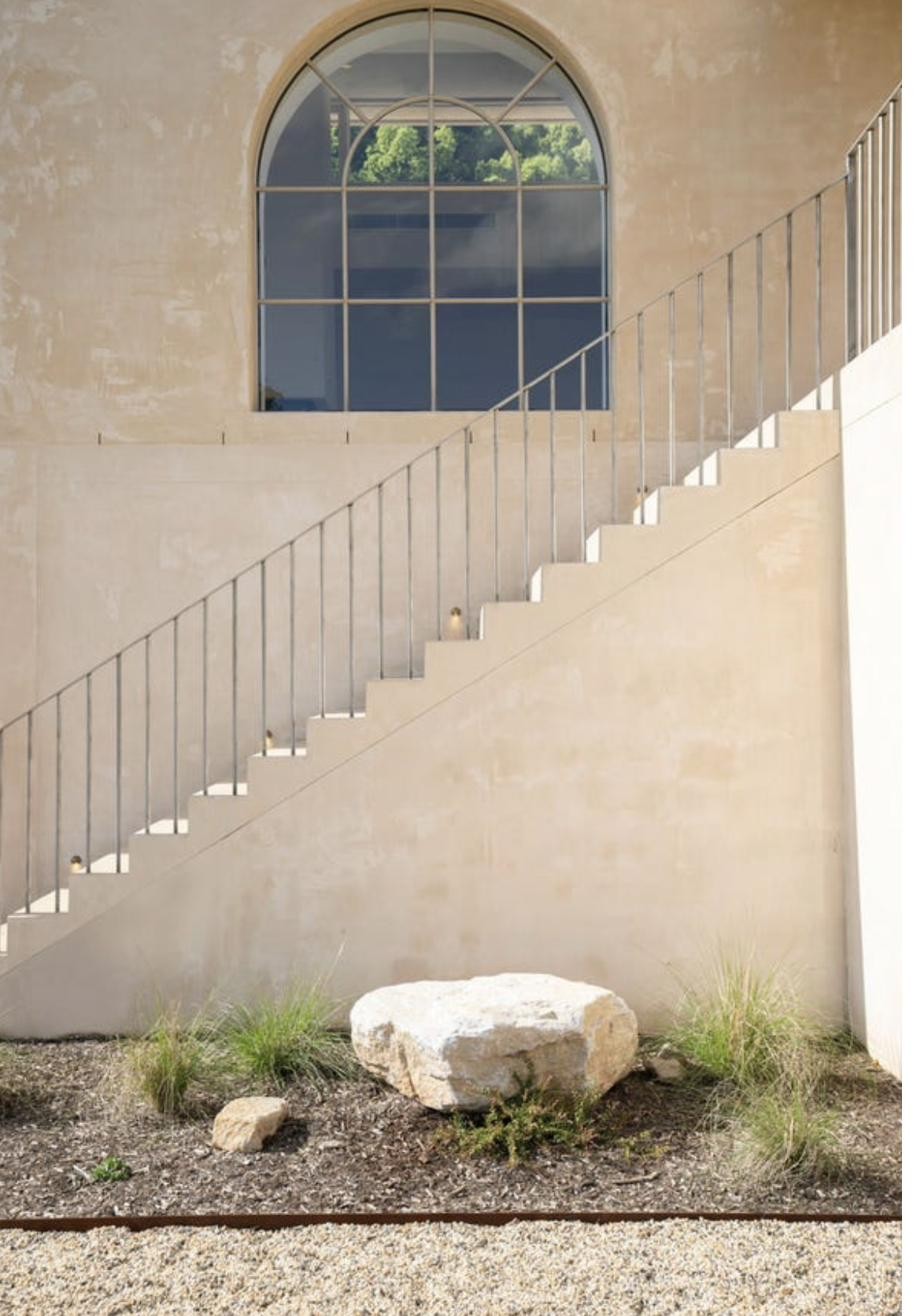 Staircase with arched window above, Komorebi Home