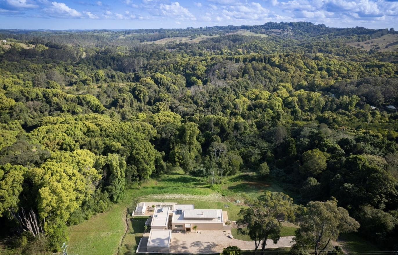 Aerial view of the residence within the surrounding forest, Komorebi Home