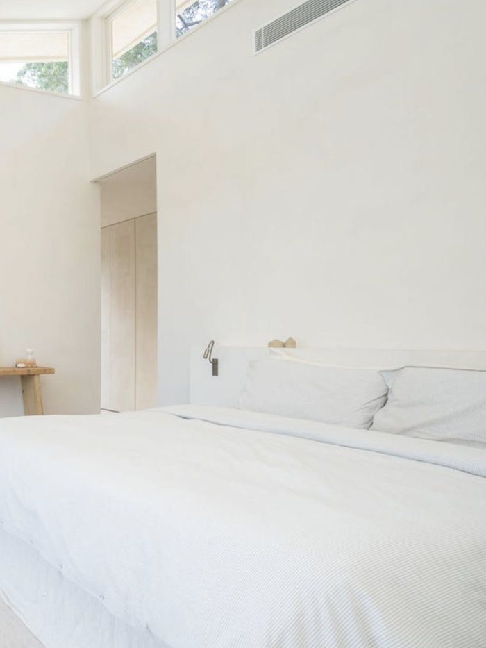 Bedroom with dark stained timber floors, Komorebi Home