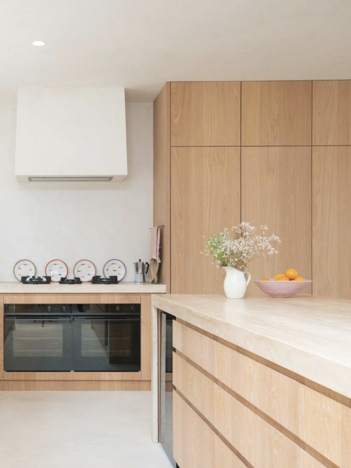 Oak joinery kitchen with travertine benchtop, Komorebi Home