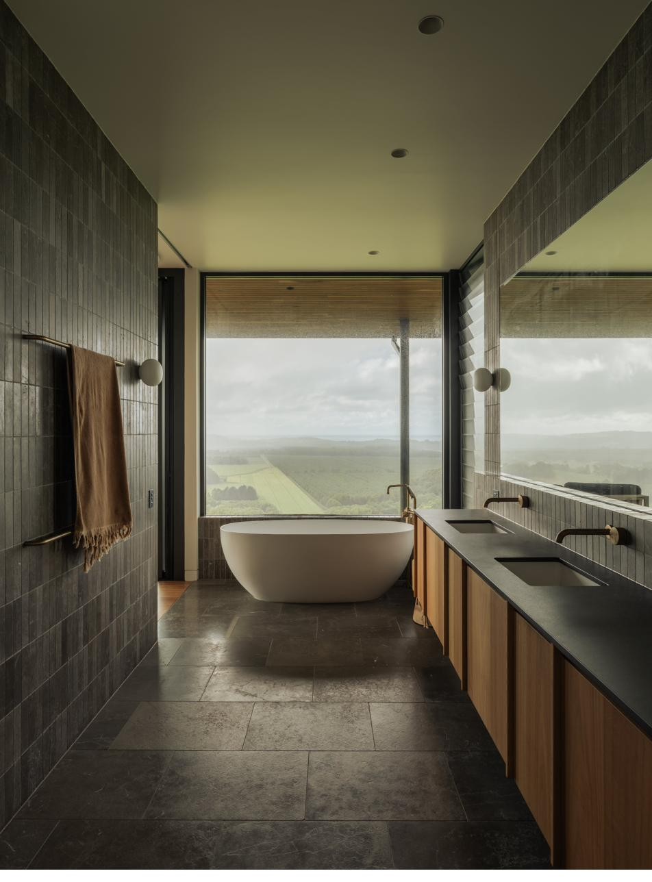 Ensuite with freestanding bath and floor-to-ceiling glazing, Newrybar Residence