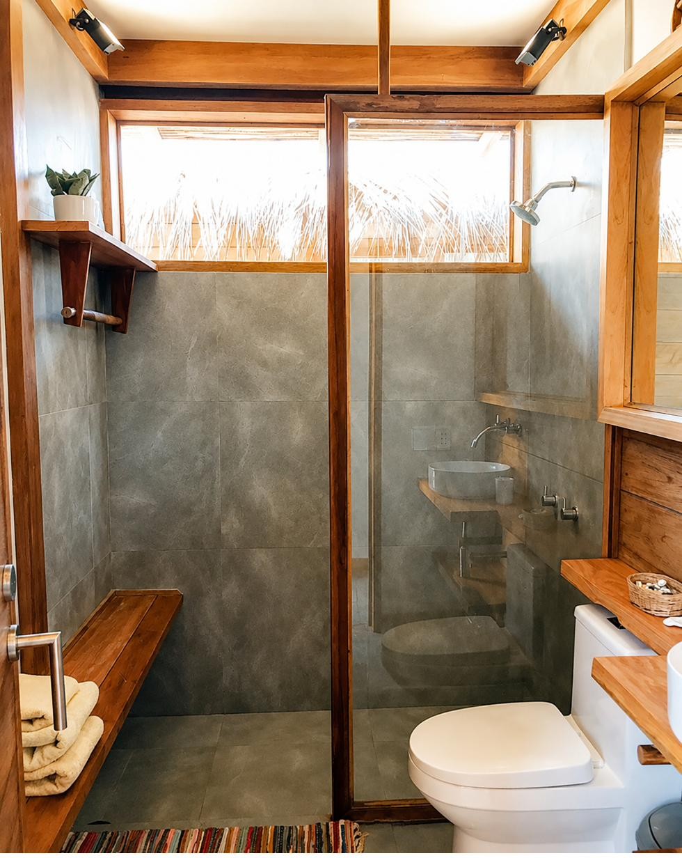 Open-air bathroom with timber vanity, Wak'a Villa